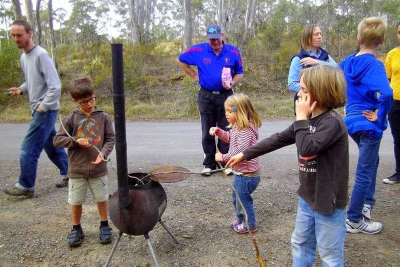 Kids roasting marshmallows.